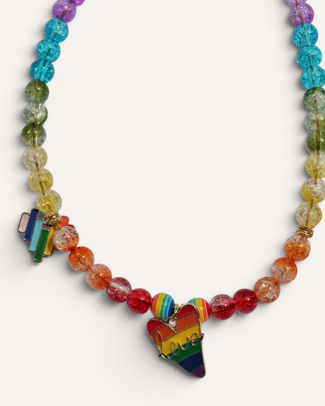 Collier pour chien rainbow translucide avec perles effet cristal, charms Pride colorés et fermoir cœur bleu – Zag & Wag
