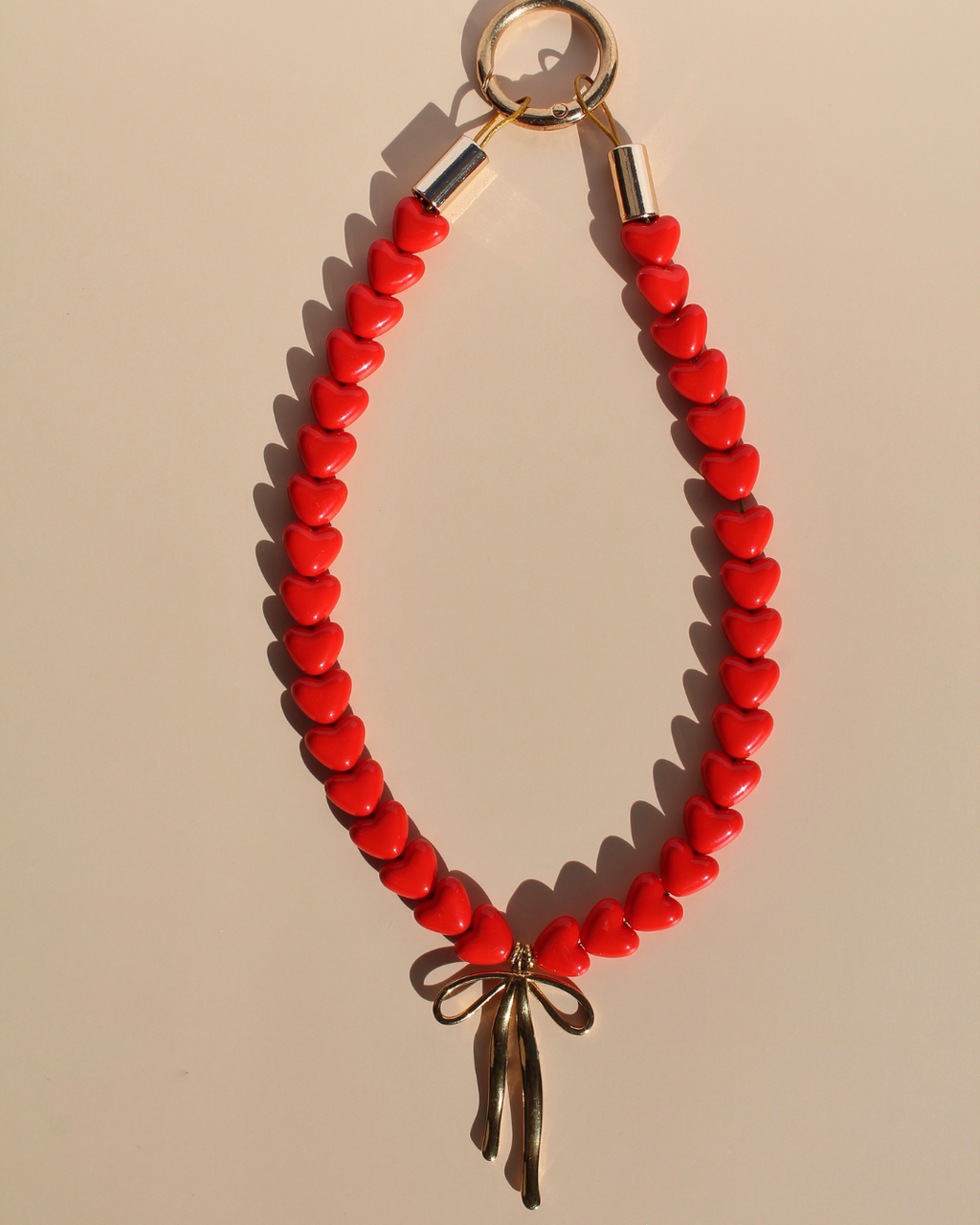 Collier artisanal rouge pour chiens et chats avec charms nœud – Zag & Wag